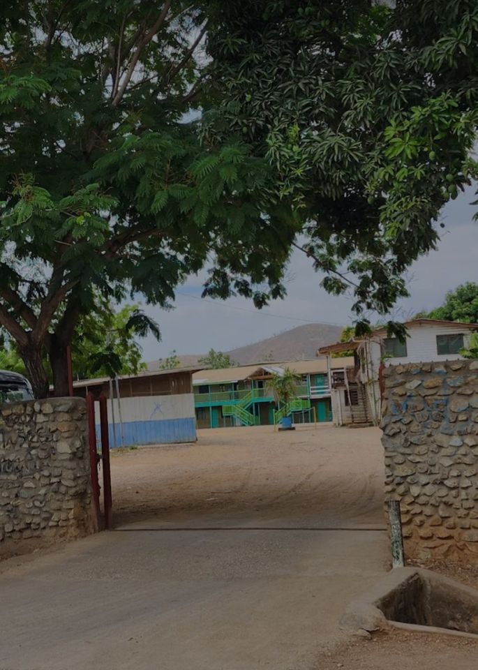 The entrance gate and campus buildings at Port Moresby Christian Academy in Gerehu Stage 6